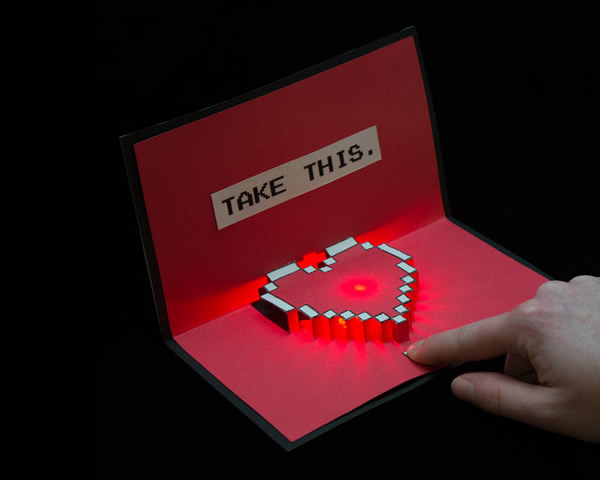 Biglietto con cuore luminoso